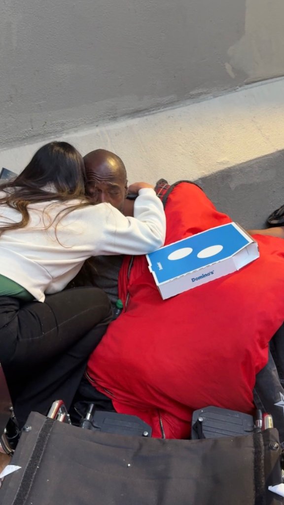 Stefania Leão sharing a moment of connection with a neighbor during San Francisco homeless outreach