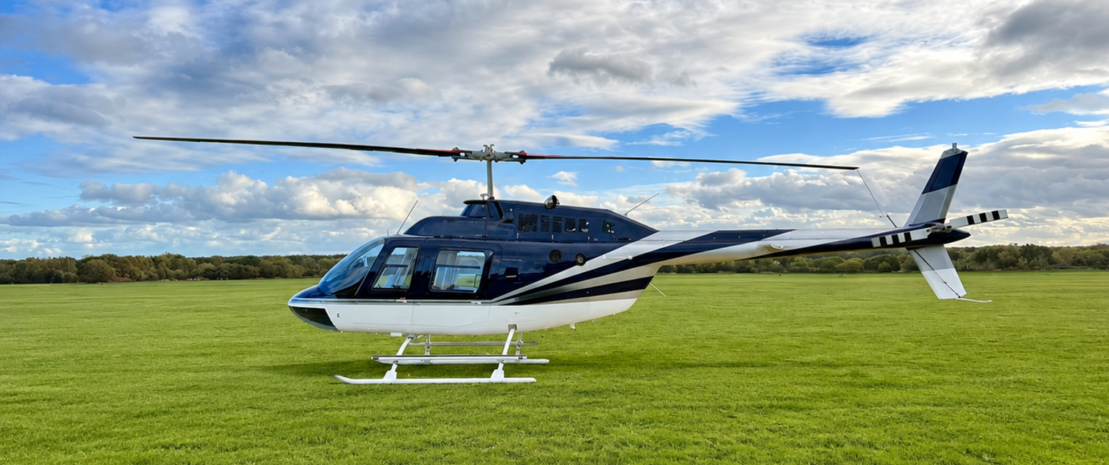 Bell JetRanger III helicopter on a grass field