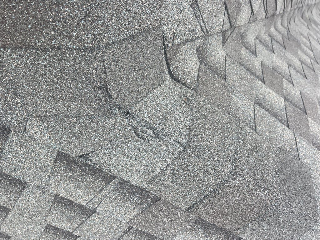 Colleyville Texas Damageto Shingle Ridge Capfrom Walkingonthe Ridges - Colleyville Roofing project photo by Becker Roofing and Exteriors