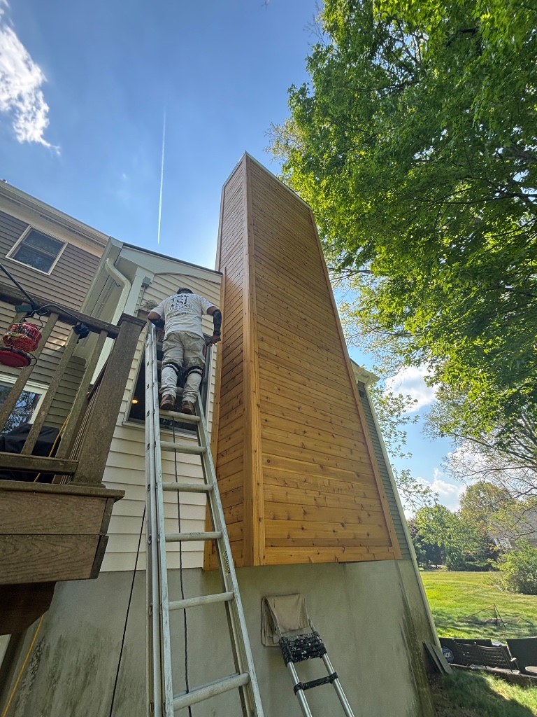 Cedar siding installation on home exterior