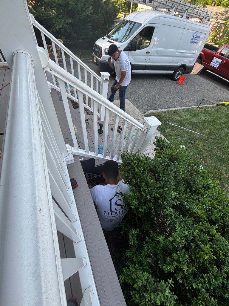 Sterling crew installing deck railing
