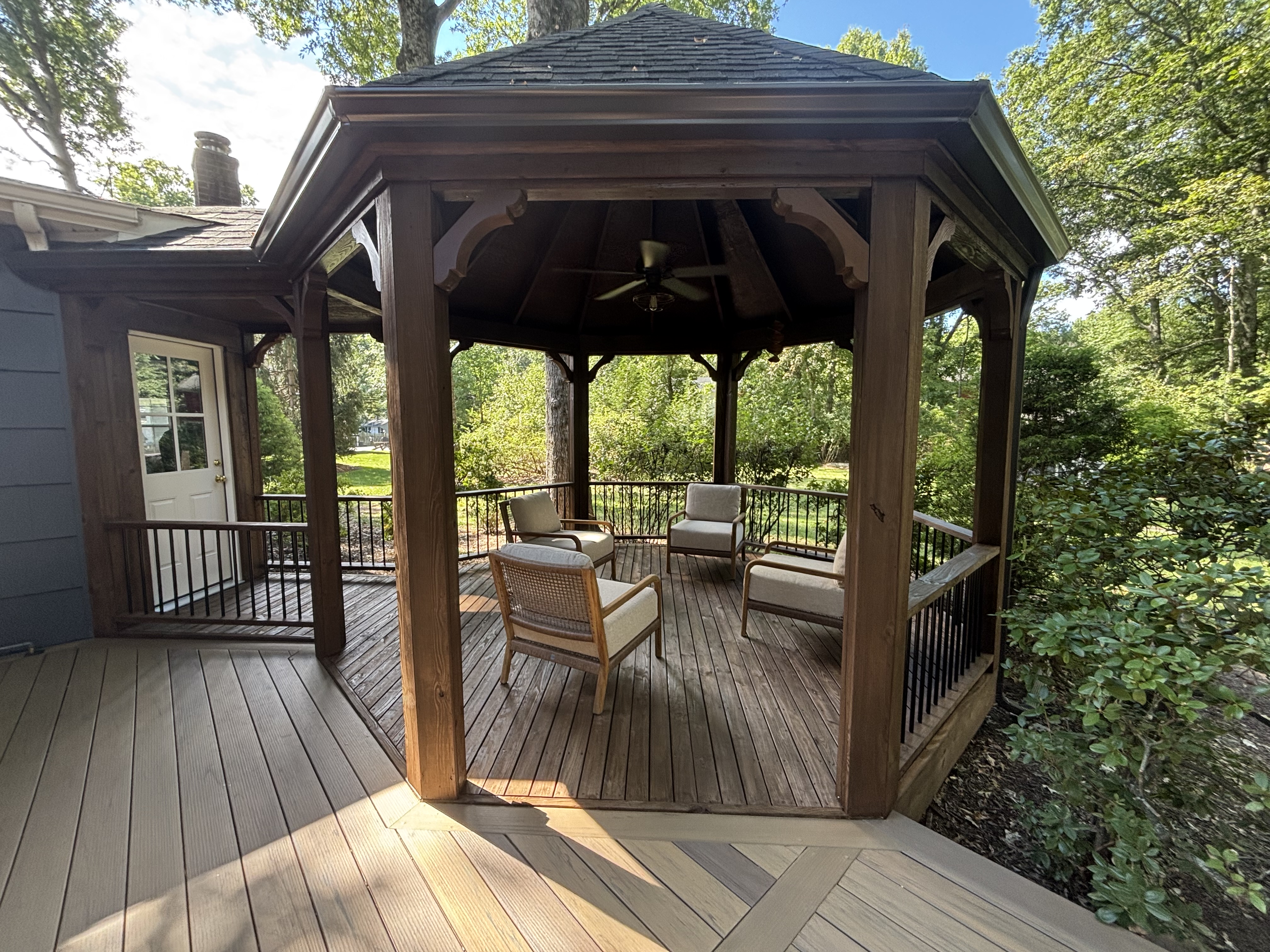 Backyard gazebo and composite deck with diagonal plank inlay
