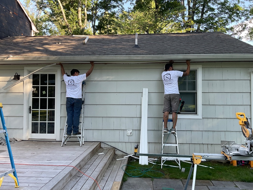 Sterling team installing gutters and fascia