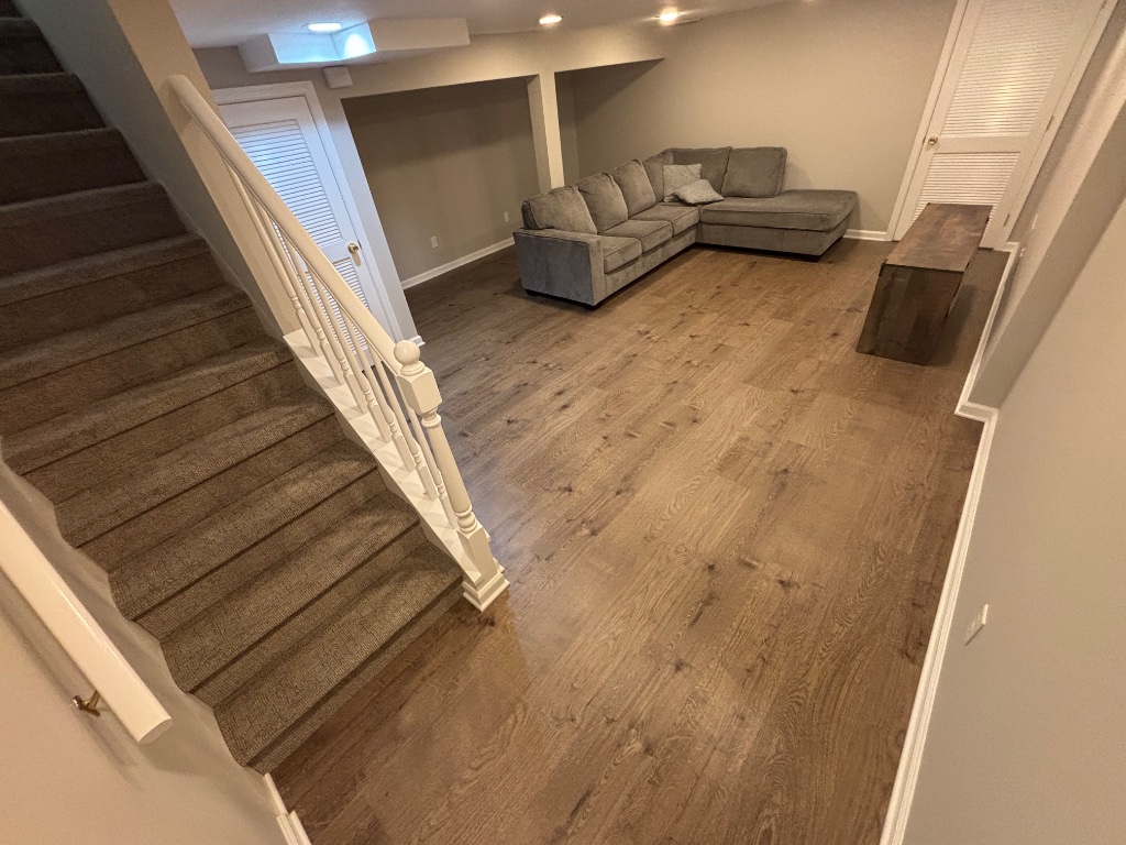 Basement staircase with new hardwood flooring