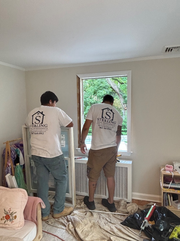 Sterling Home Improvements crew installing a window