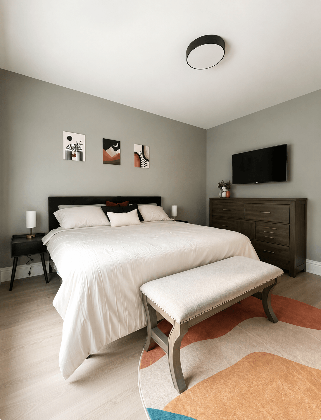 Modern neutrally-styled bedroom with sage walls and terracotta accents