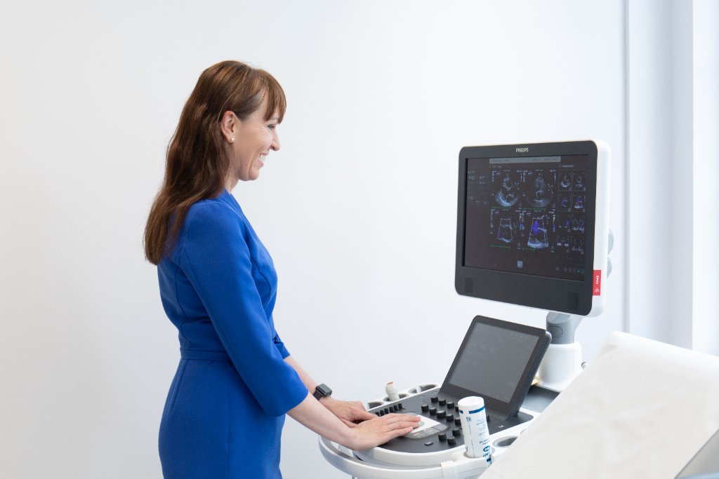 Dr Wamil reviewing a patient's treatment plan with the cardiology team