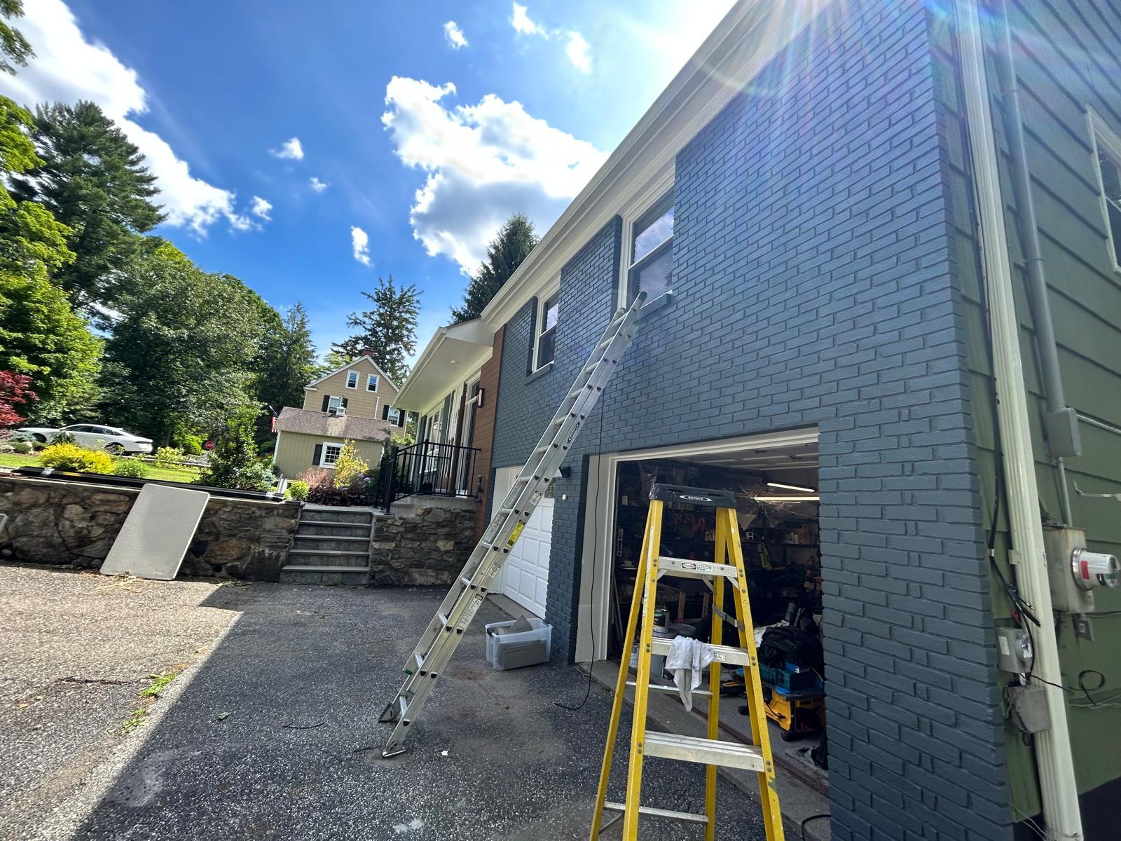 Garage brick repainted with new siding in Mount Kisco