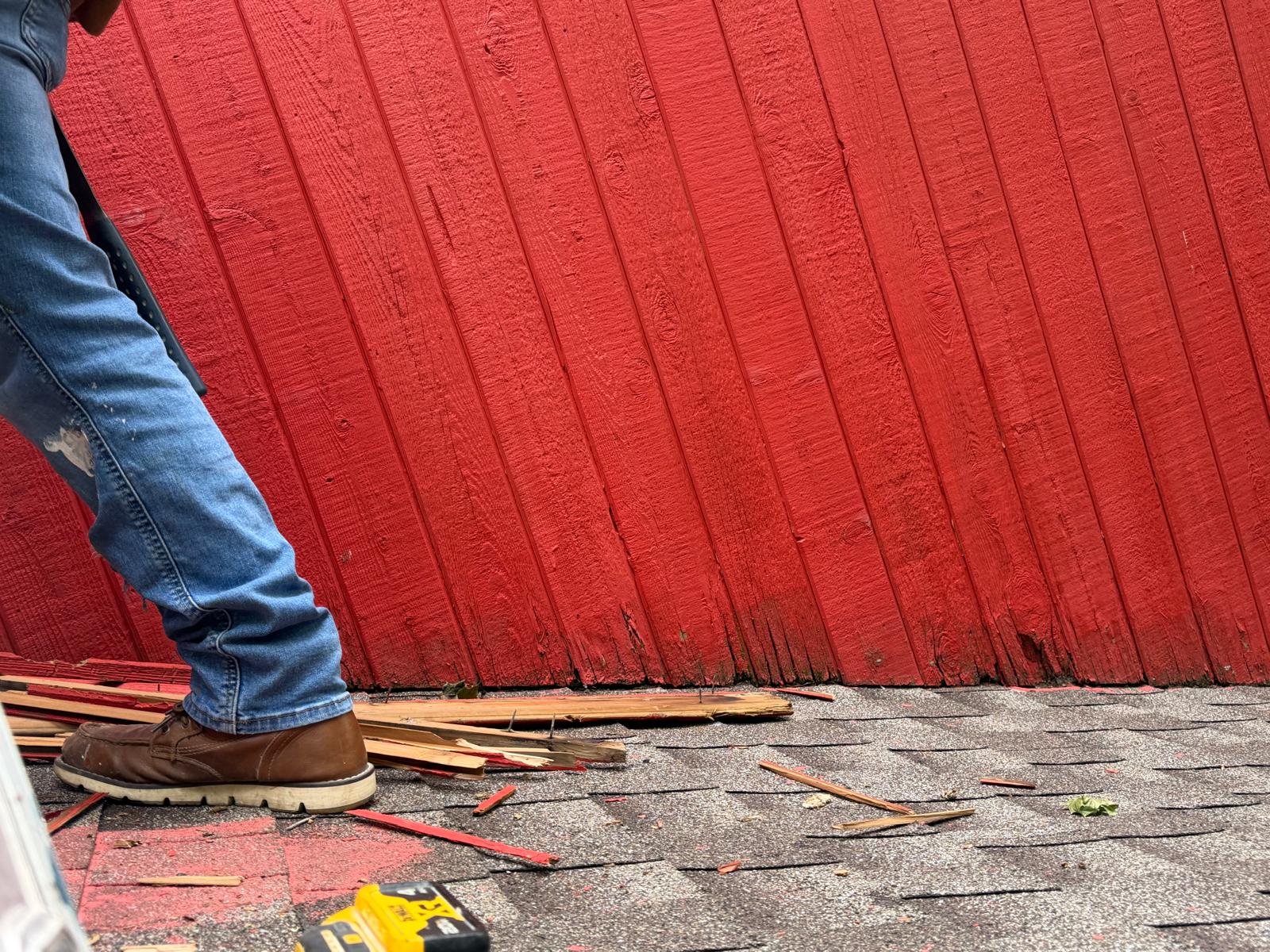 Exterior repair — rotted trim removed at the upper siding edge in Hartsdale