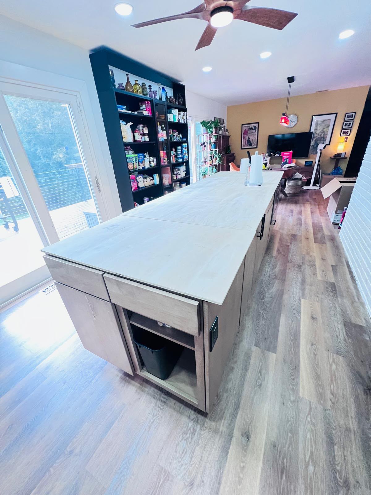 Island and pantry tying into the open living area in Mount Kisco