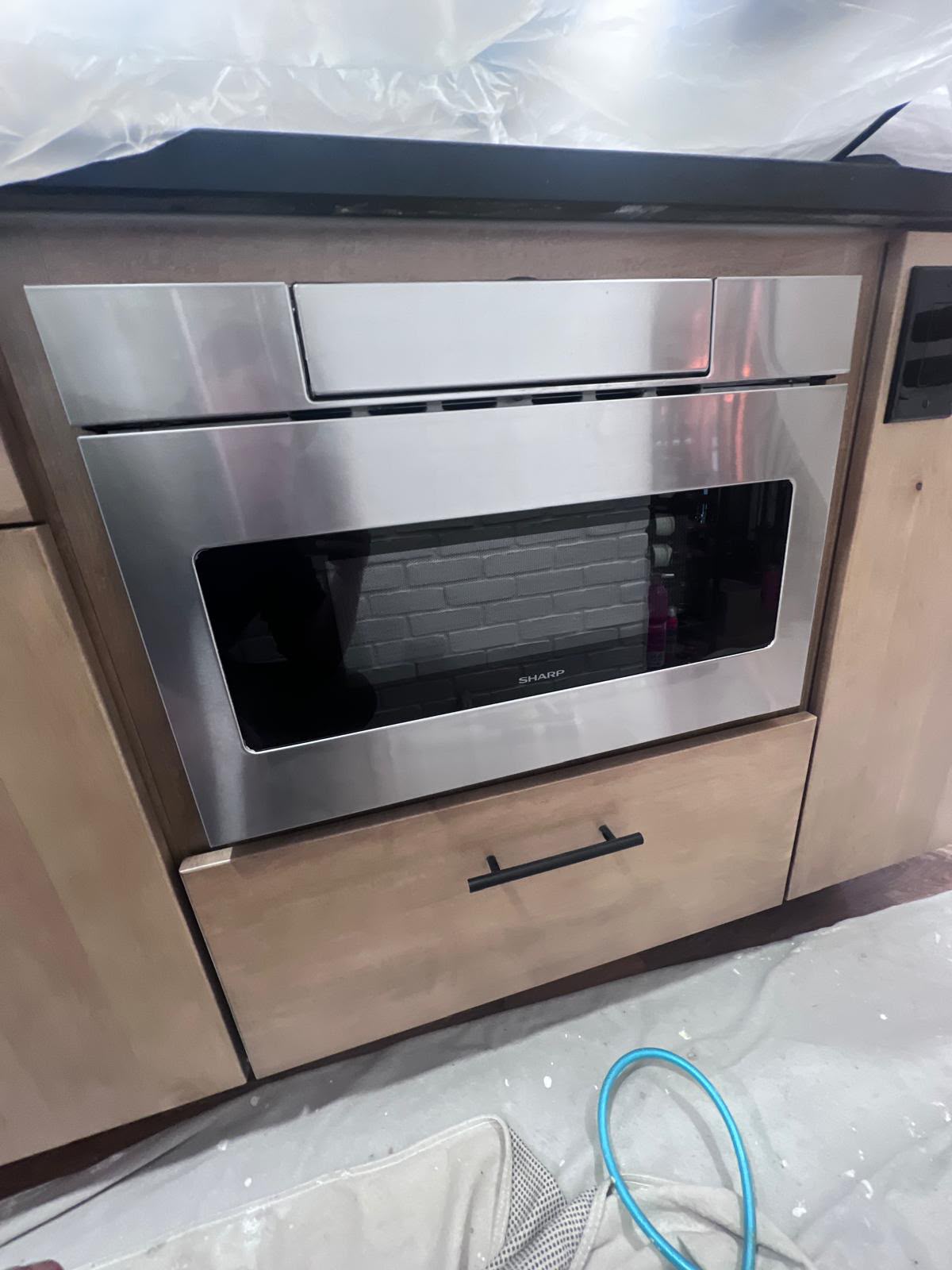 Microwave drawer built into the cabinet run in Mount Kisco