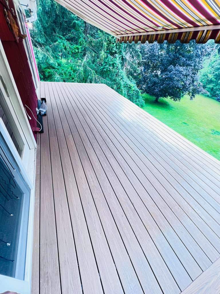 Finished deck under the retractable awning in Mount Kisco