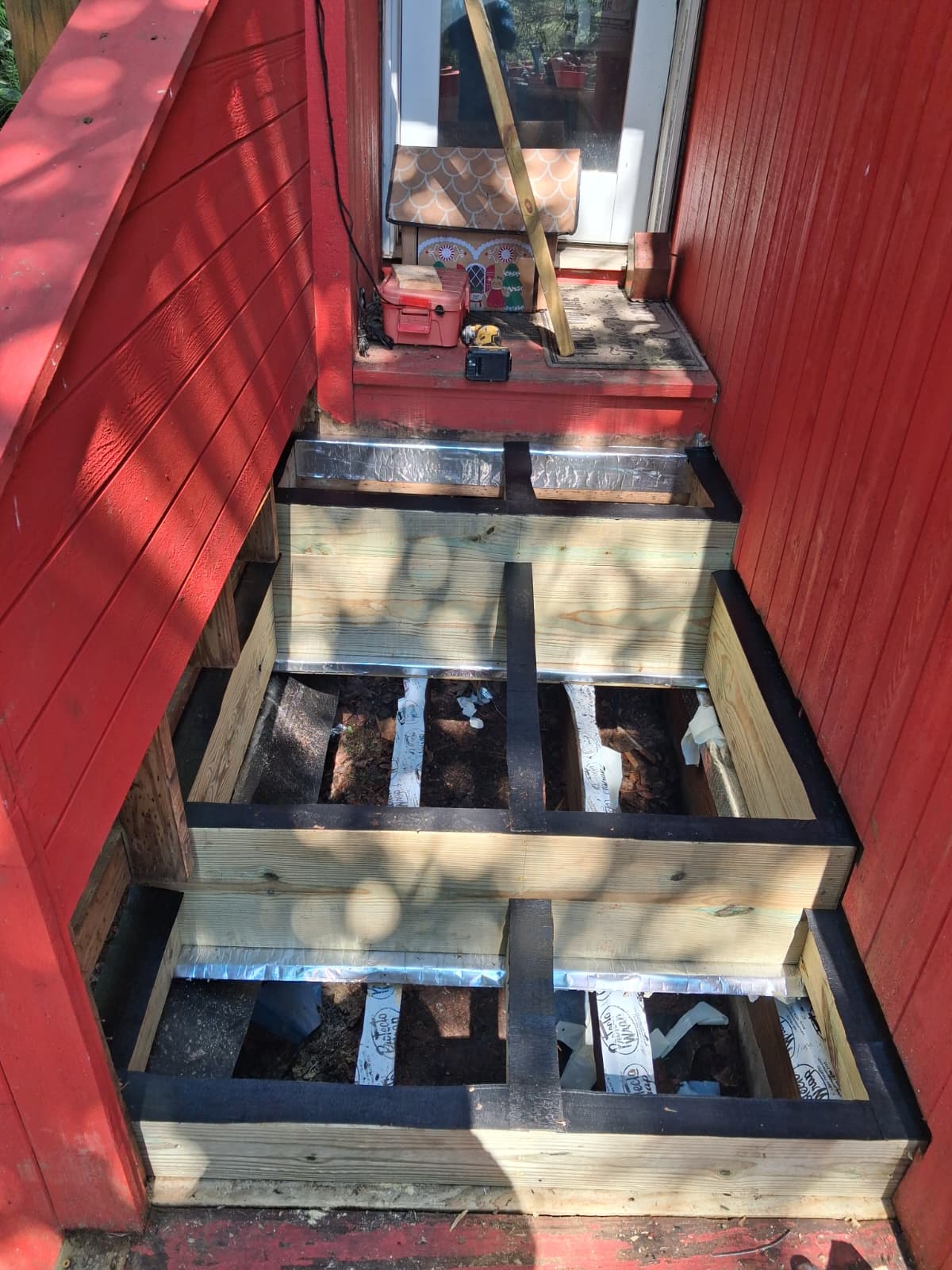 Deck stairs reframed with pressure-treated stringers and flashing in Hartsdale