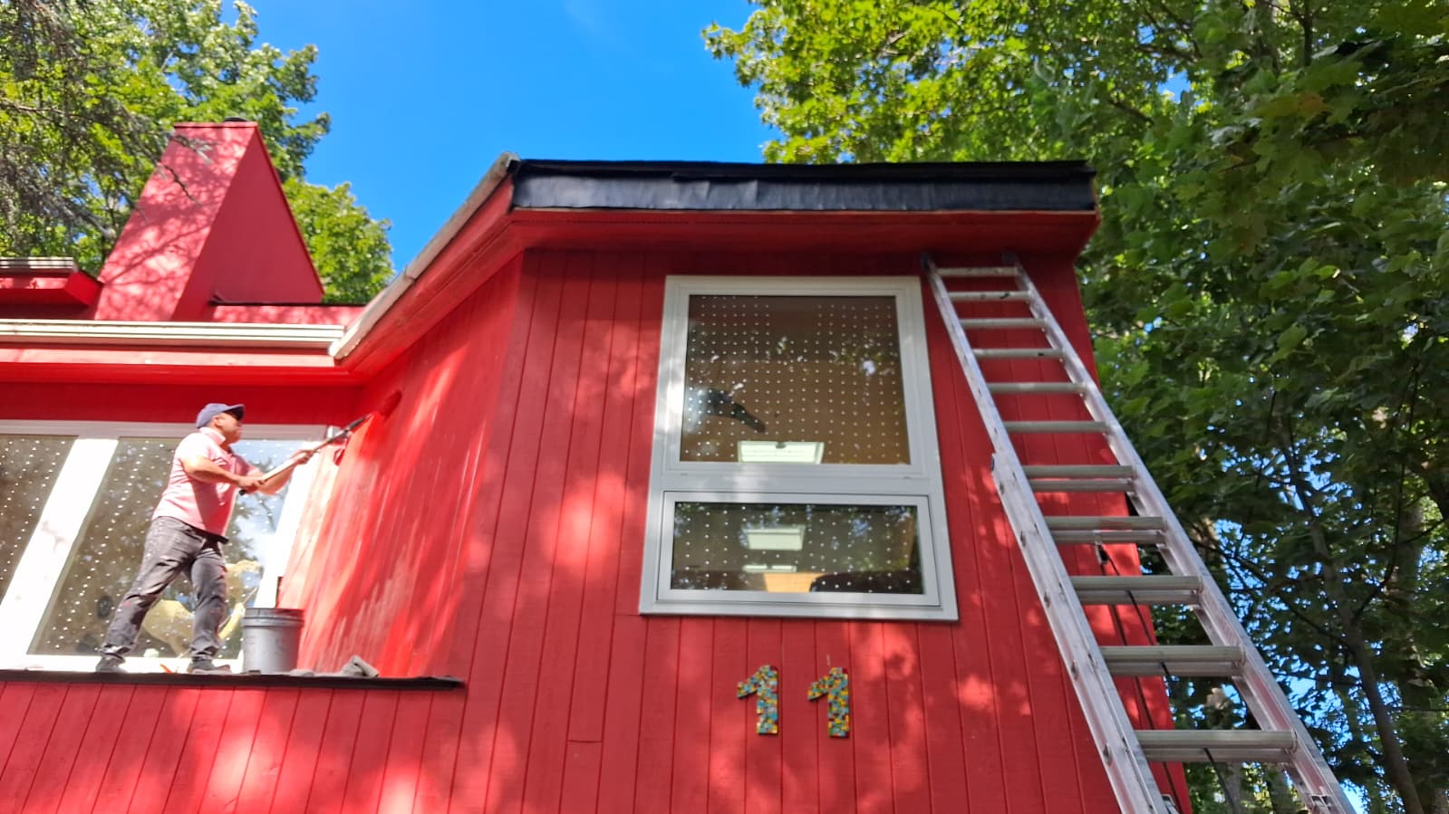 Whole house exterior painting — red finish coat on the siding in Hartsdale