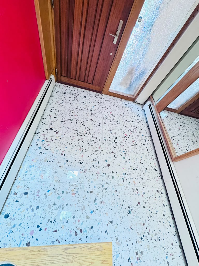 Terrazzo tile floor — finished hall at the red accent wall in Hartsdale