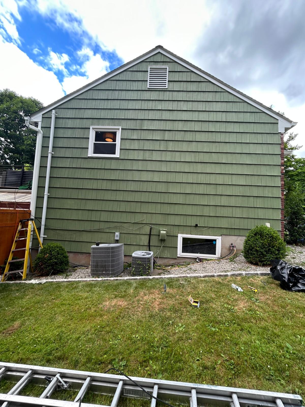 Side wall re-shingled in olive green in Mount Kisco