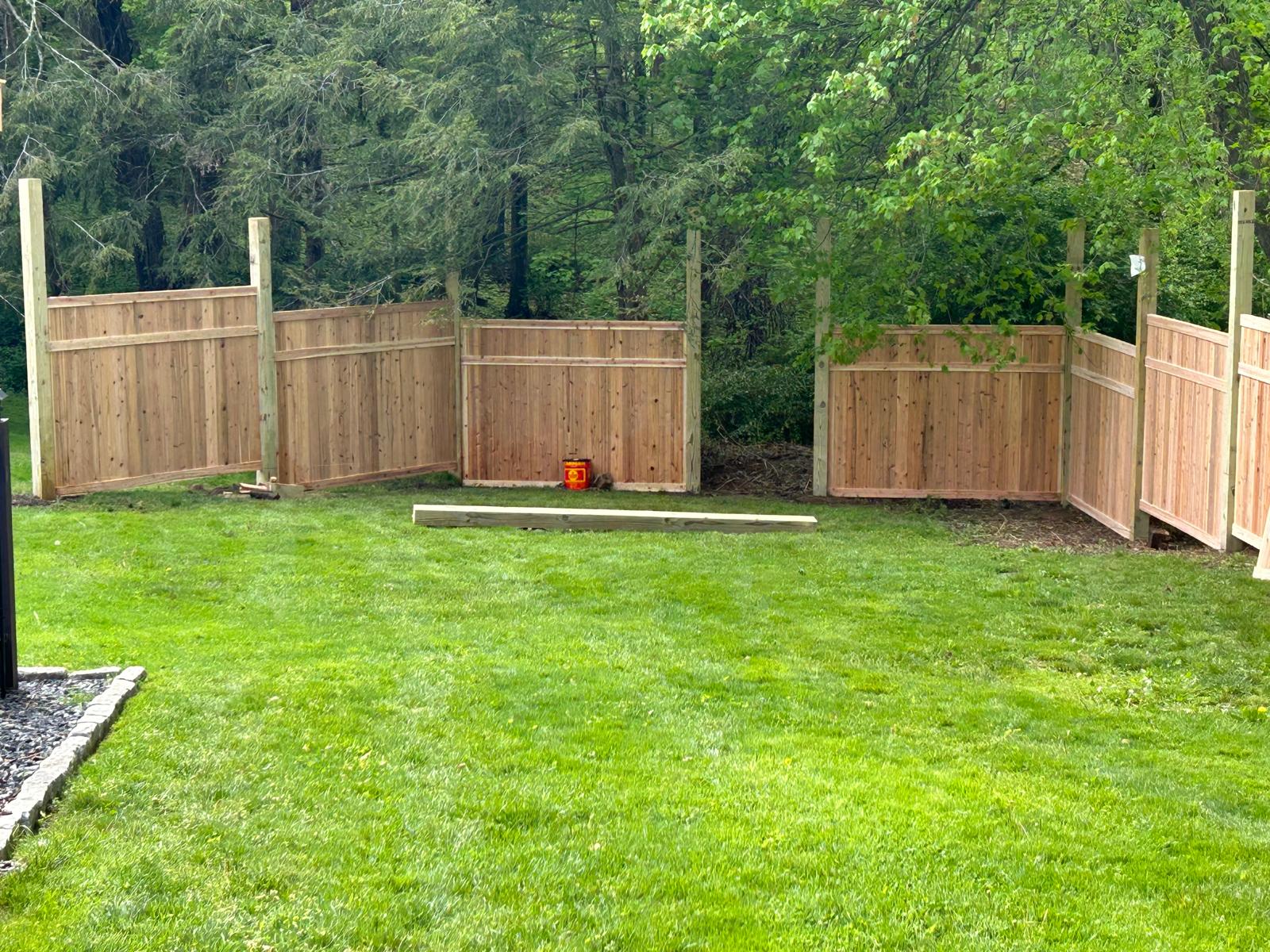 Tiered cedar fence following the backyard grade in Mount Kisco