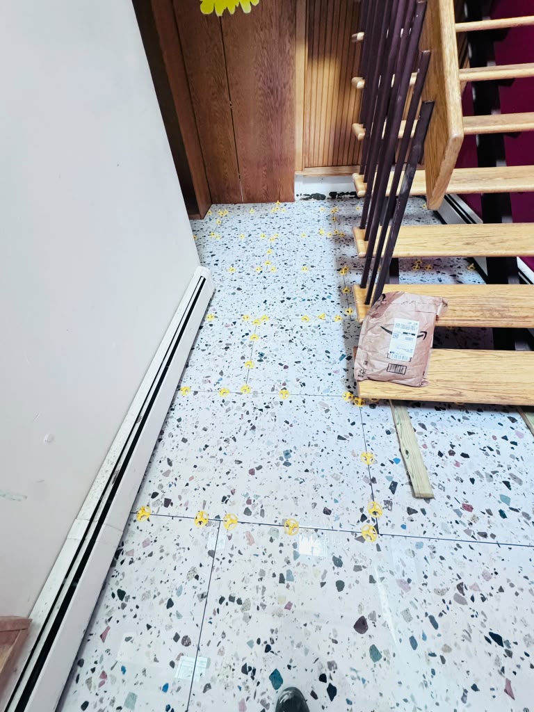 Terrazzo tile floor — tile carried into the open-riser stair in Hartsdale