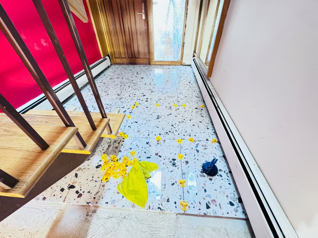Terrazzo tile floor — hallway installation with leveling clips in Hartsdale
