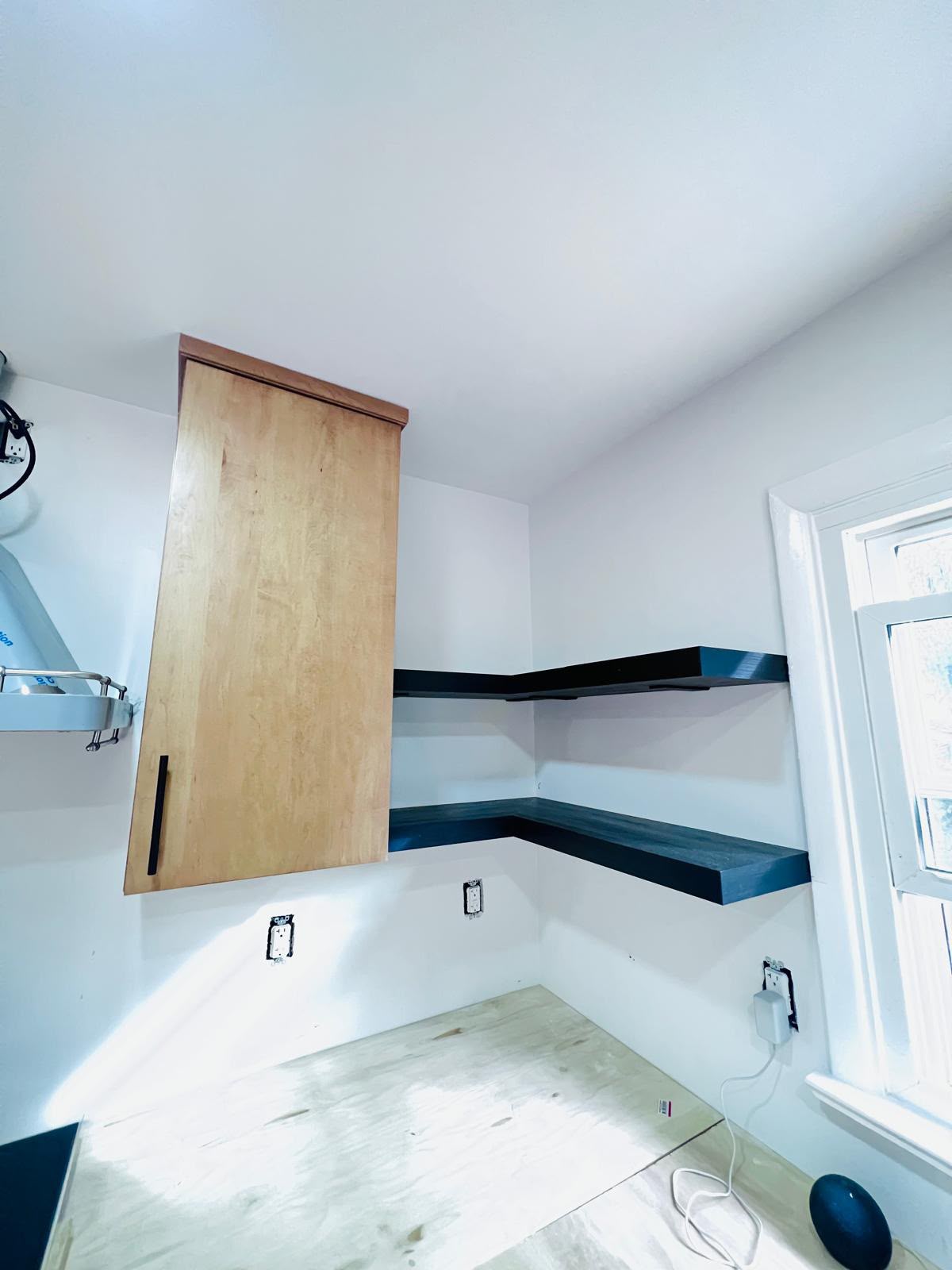 Floating shelves and outlet layout on the backsplash wall in Mount Kisco