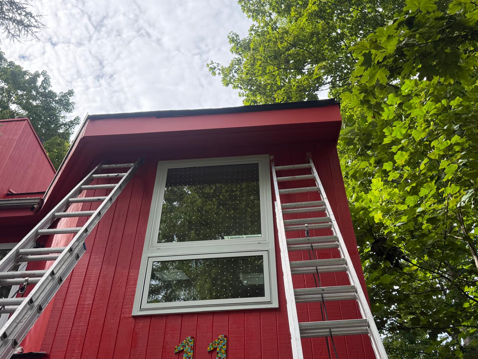 Whole house exterior painting — siding prepped with ladders set in Hartsdale