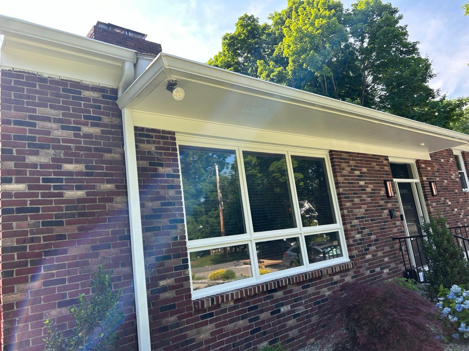 Front entry with new window and wall lanterns in Mount Kisco