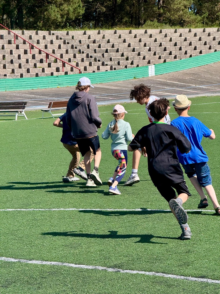 Kids running sports games sailing camp