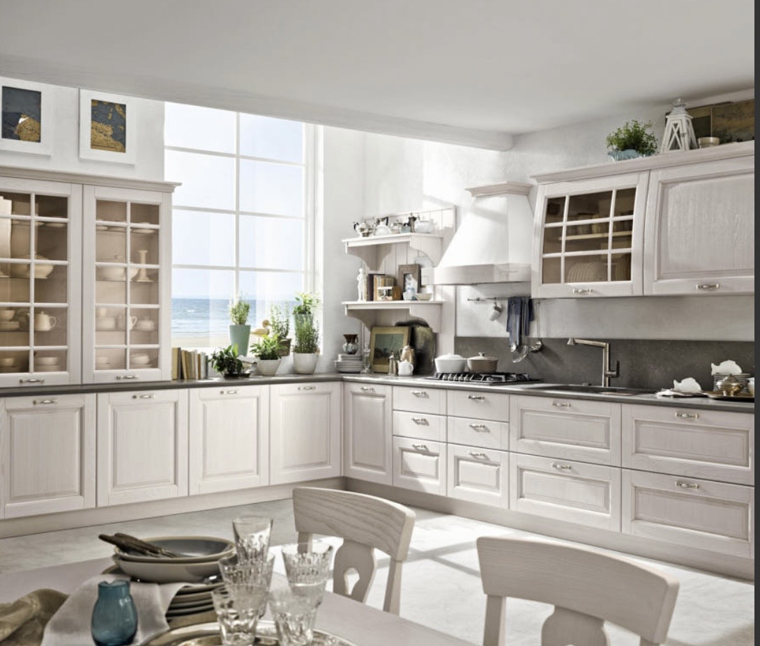 Classic light-toned kitchen with display cabinets