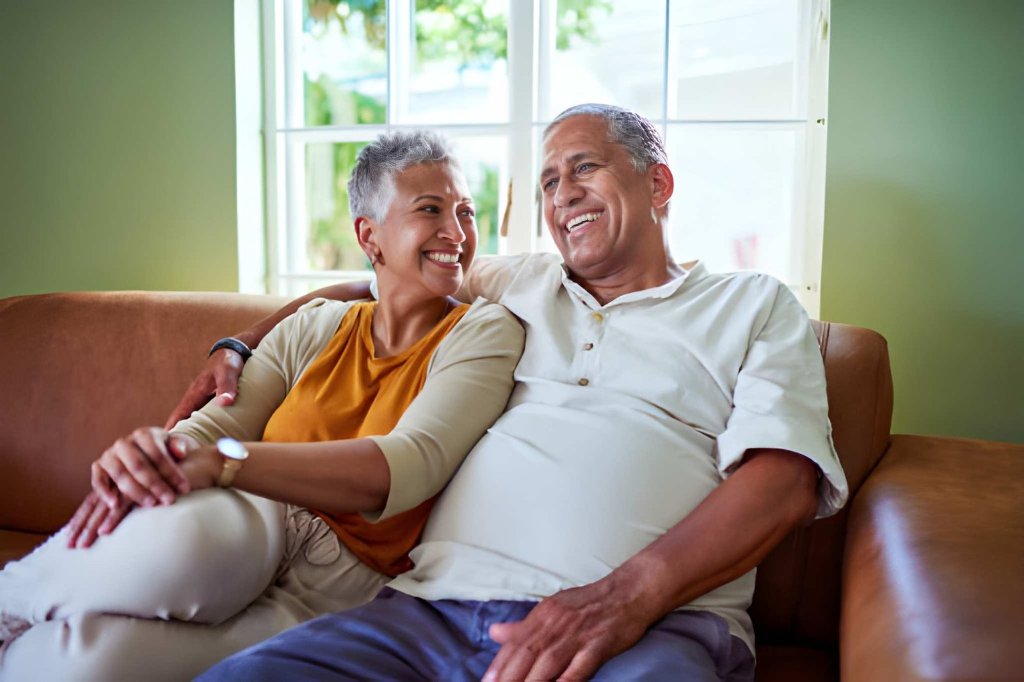 Couple relaxed at home after debt review removal
