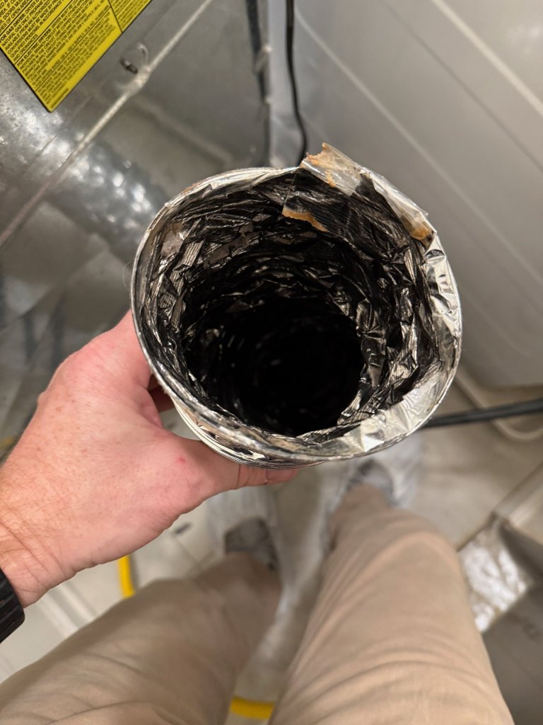 Dryer duct after cleaning — clear airflow restored