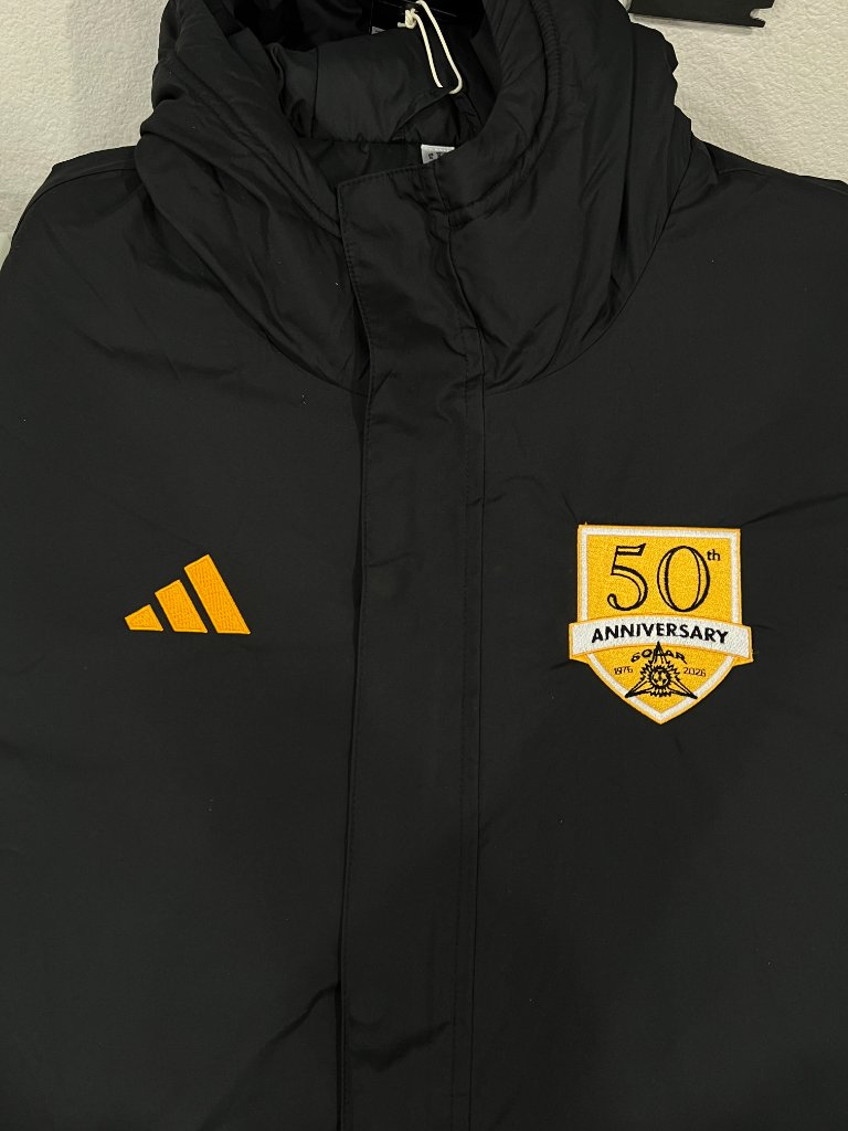 50th anniversary emblem embroidered on a black jacket by Sew Suite