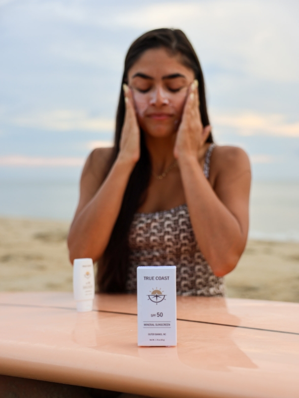 True Coast sunscreen box on surfboard