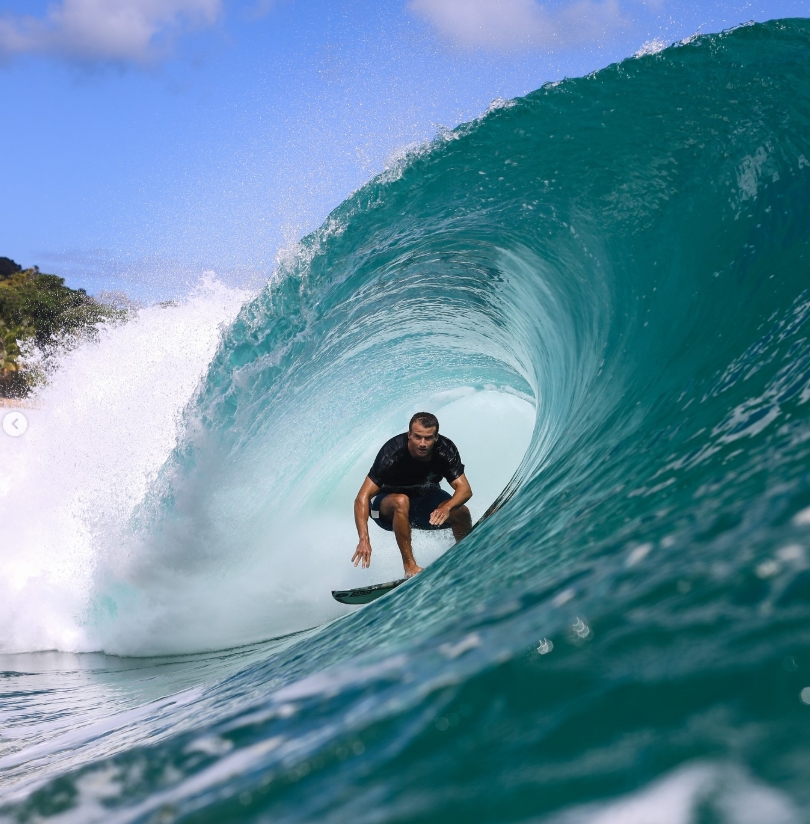 Quentin Turko surfing inside a barrel wave on the Outer Banks
