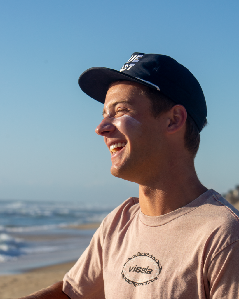 Man in Vissla shirt on beach