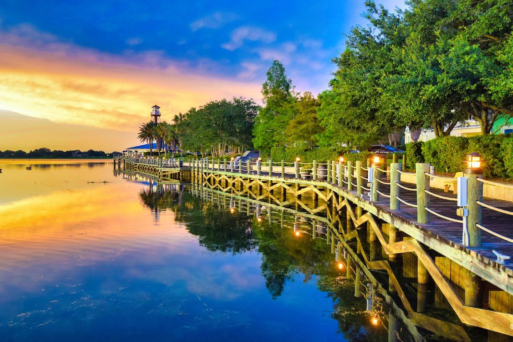 Boardwalk over a calm lake at sunset in The Villages, Florida