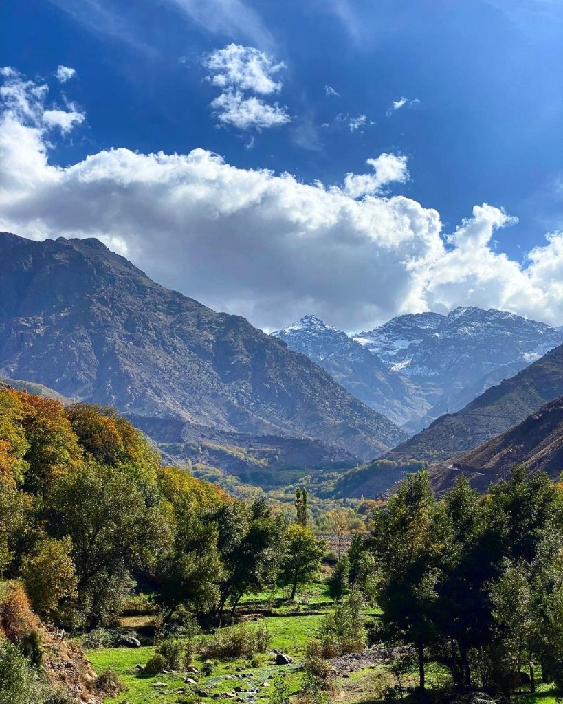 A green valley leading toward the snow-capped peaks of the High Atlas Mountains near Imlil
