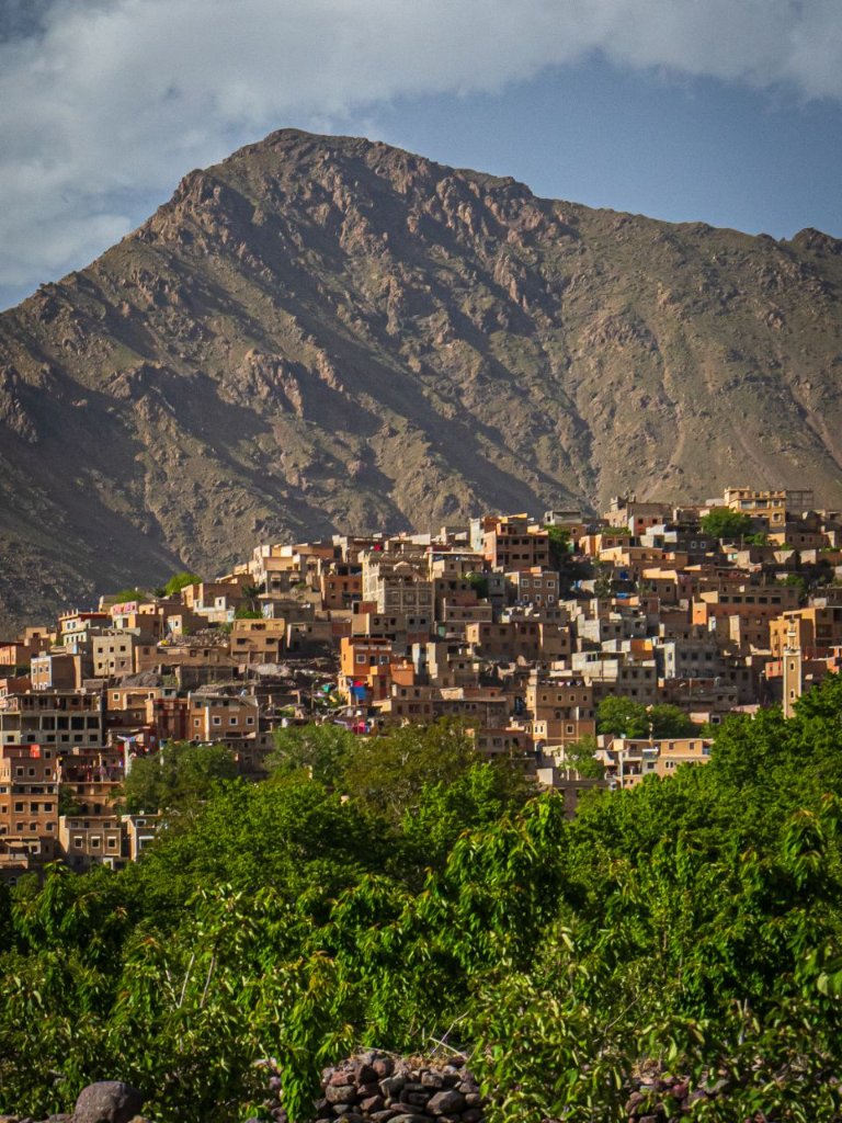The village of Imlil nestled against the rugged slopes of the High Atlas Mountains
