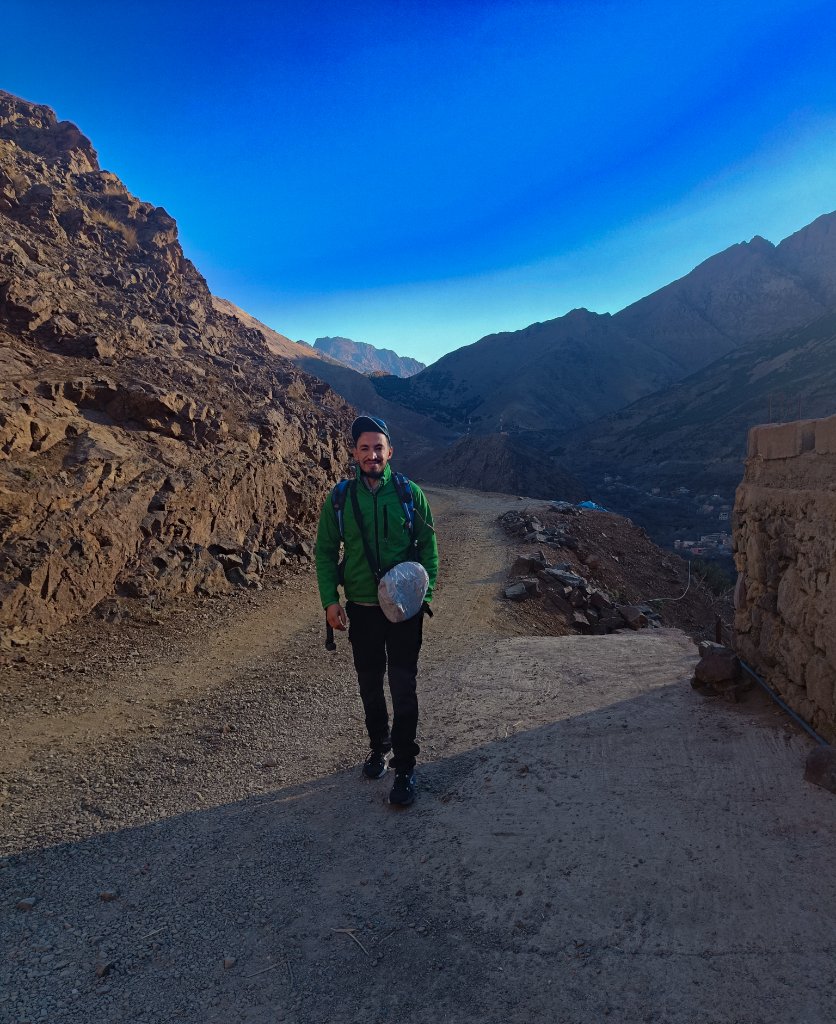 Hamid Bouredda, licensed local guide, walking a mountain trail in the High Atlas