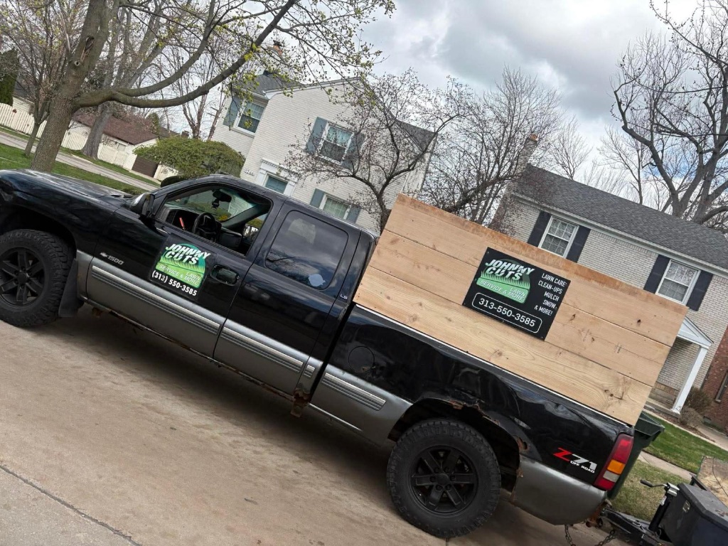 Johnny Cuts branded work truck in Grosse Pointe Farms neighborhood