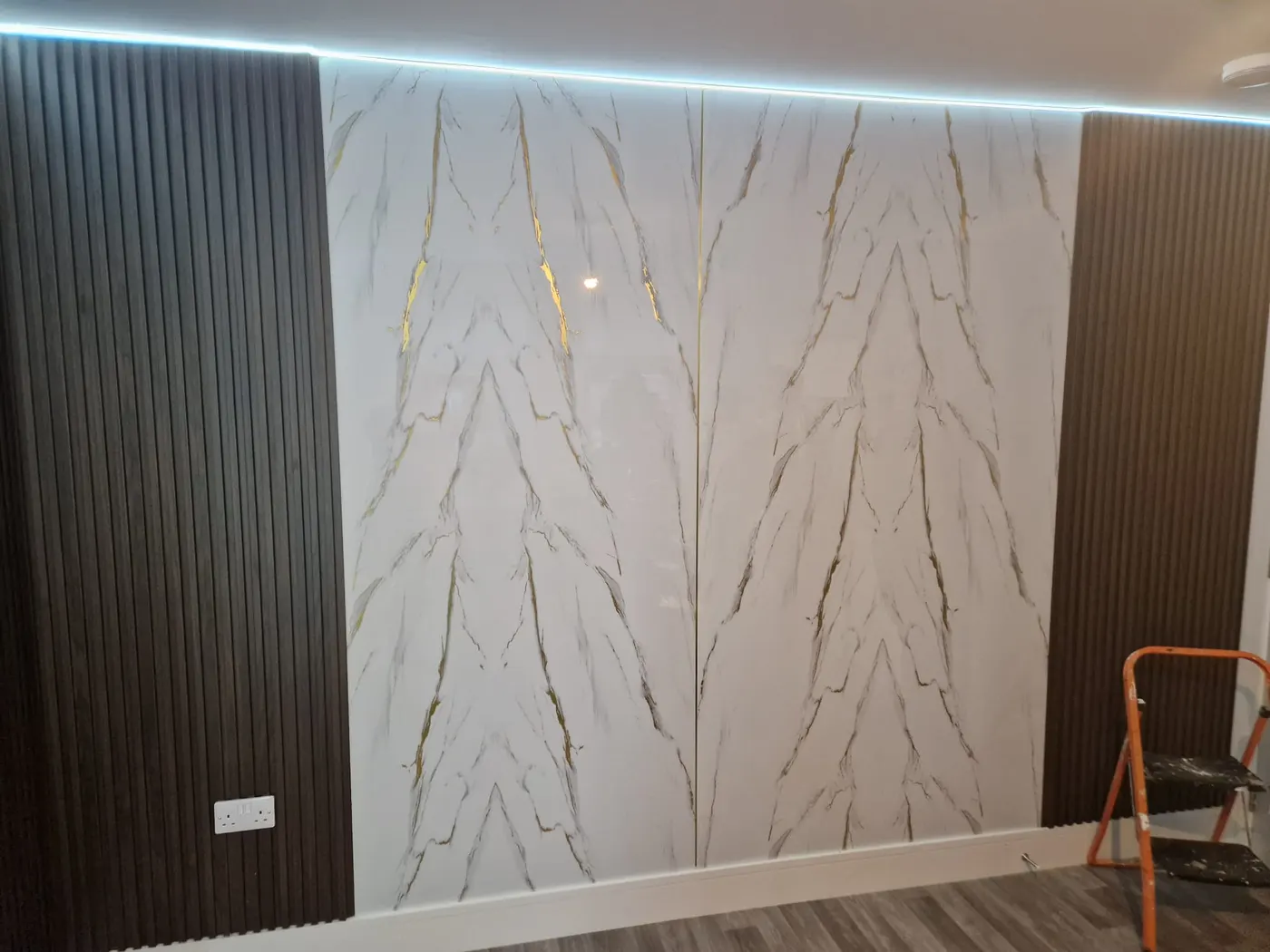 White, Gold and Grey Wall Panel and Brown Slat Panels
