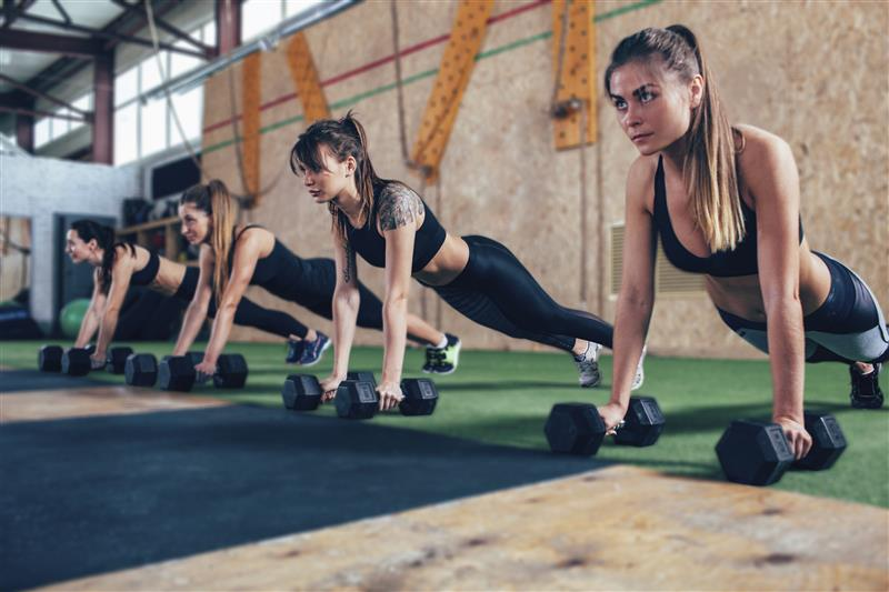 Boutique fitness studio with teal lighting