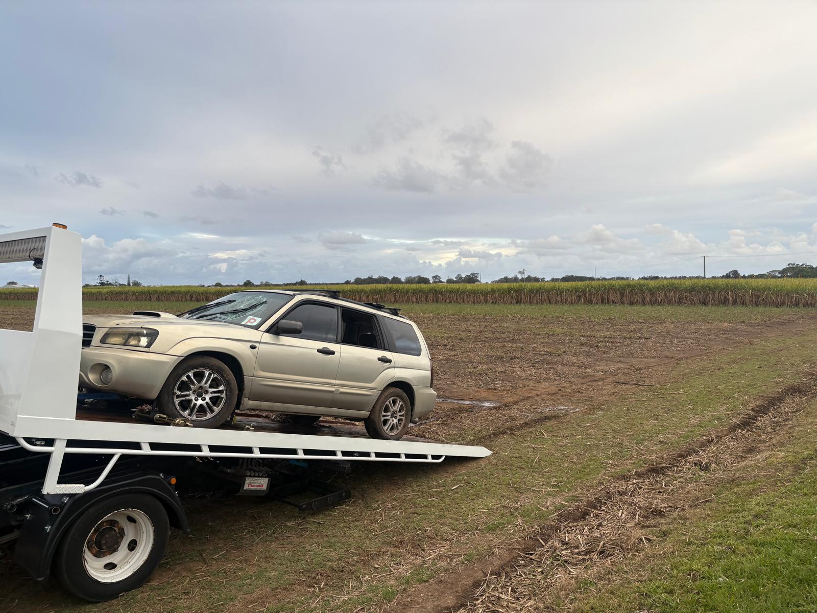 Recovered Subaru Forester loaded onto tilt tray tow truck ready for transport