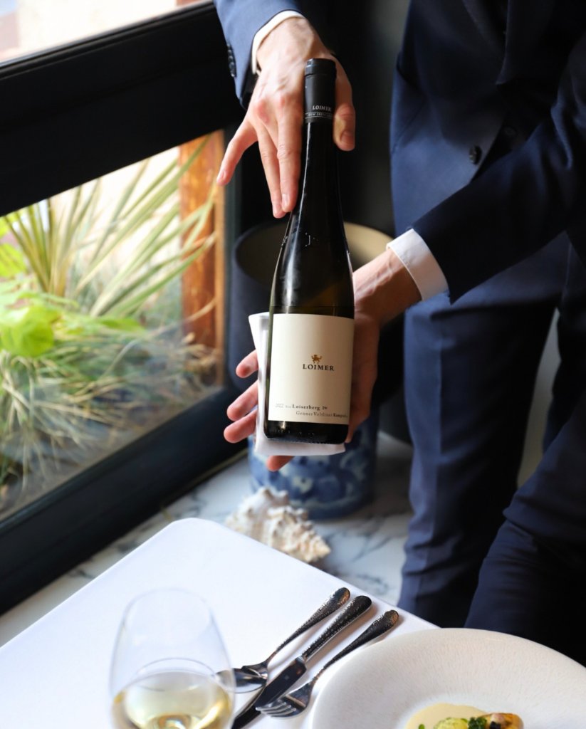 Sommelier presenting Loimer wine