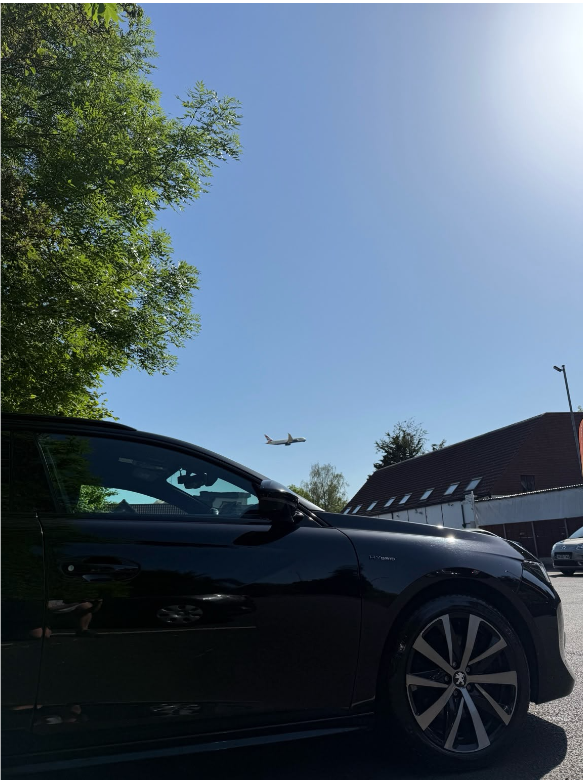 Deb's car with aircraft overhead