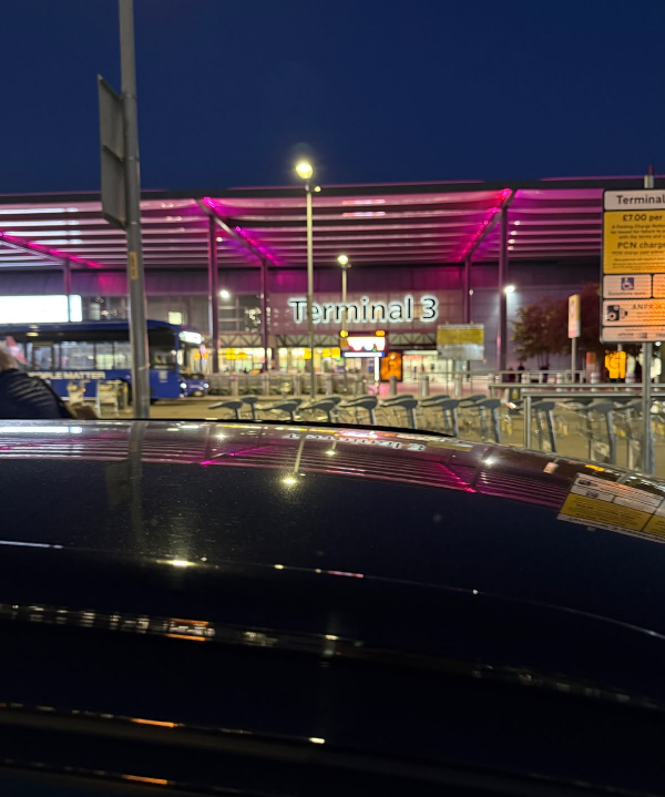 Heathrow Terminal 3 at dusk from inside the car