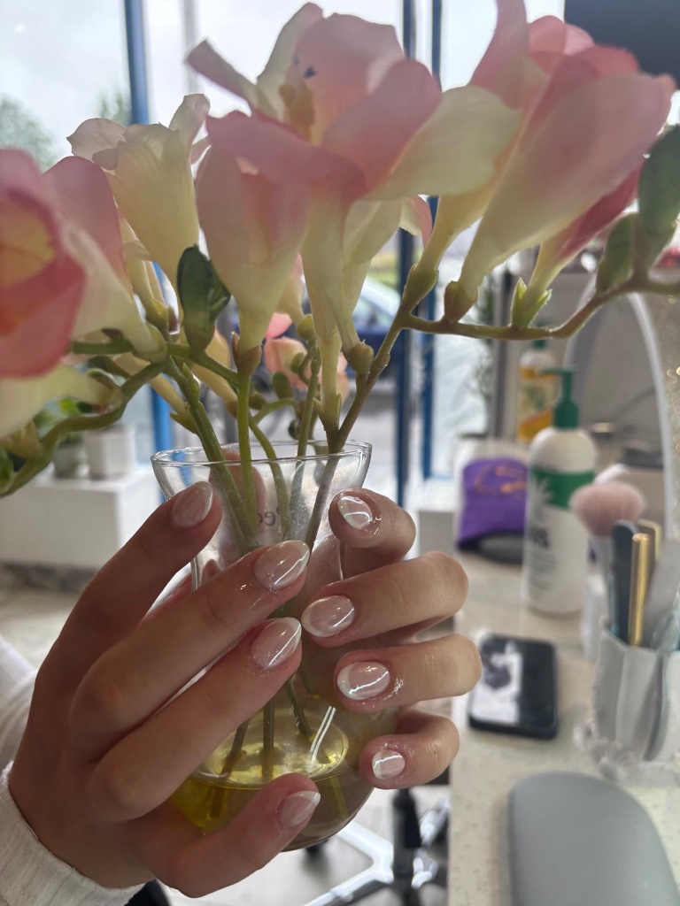 Soft pink nails with freesia bouquet
