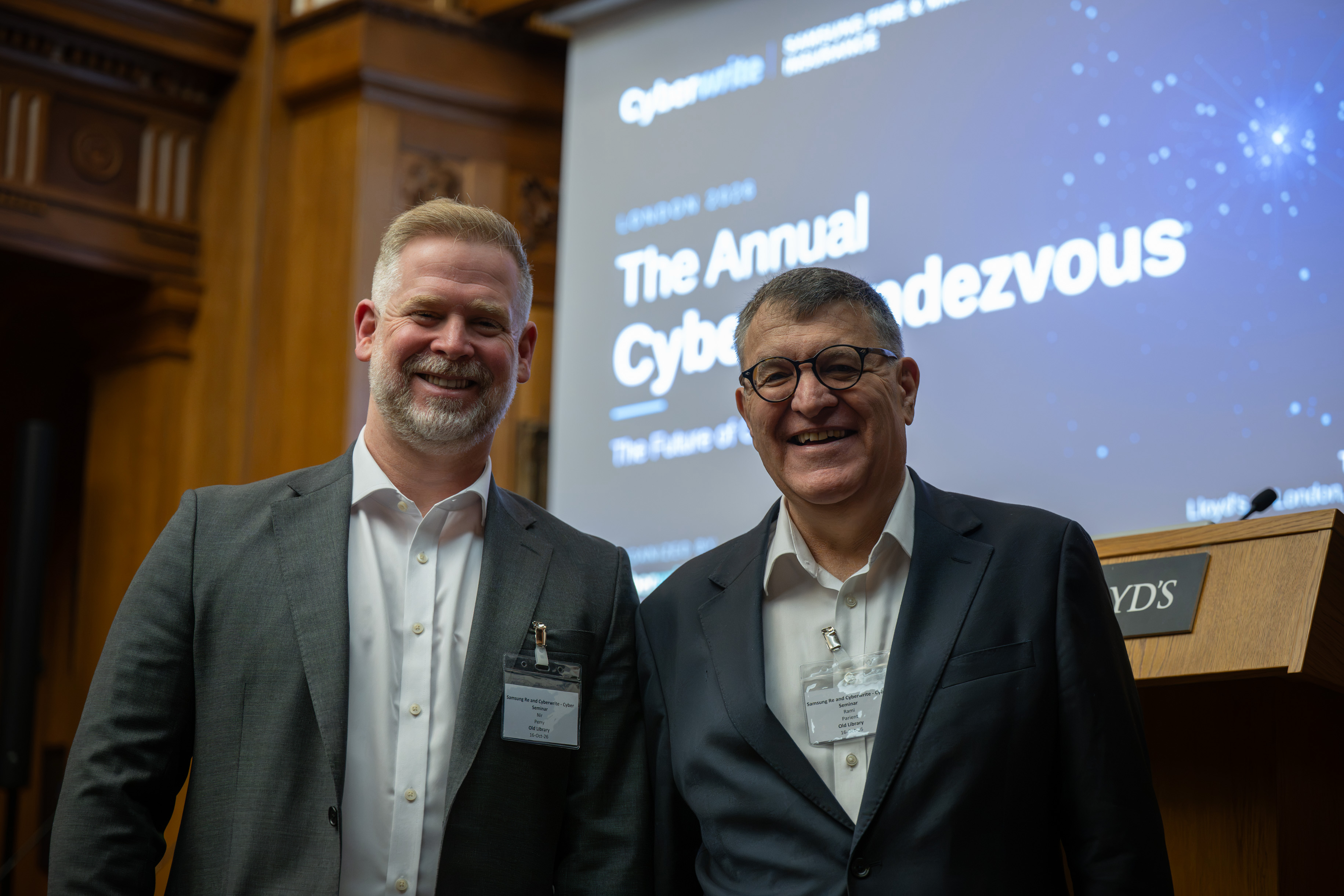 Speakers in front of the Annual Cyber Rendezvous opening slide.