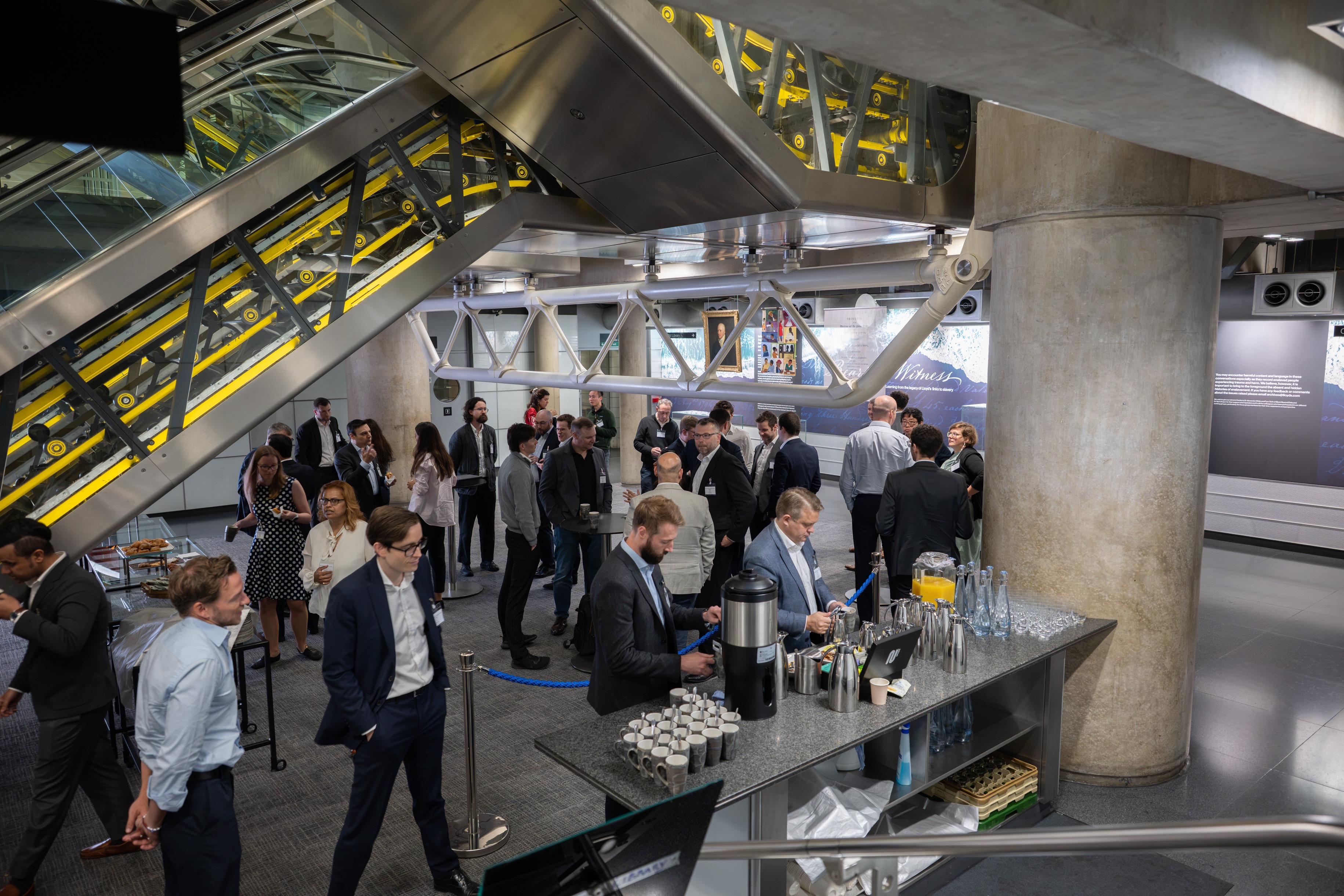 Attendees gathering over refreshments.