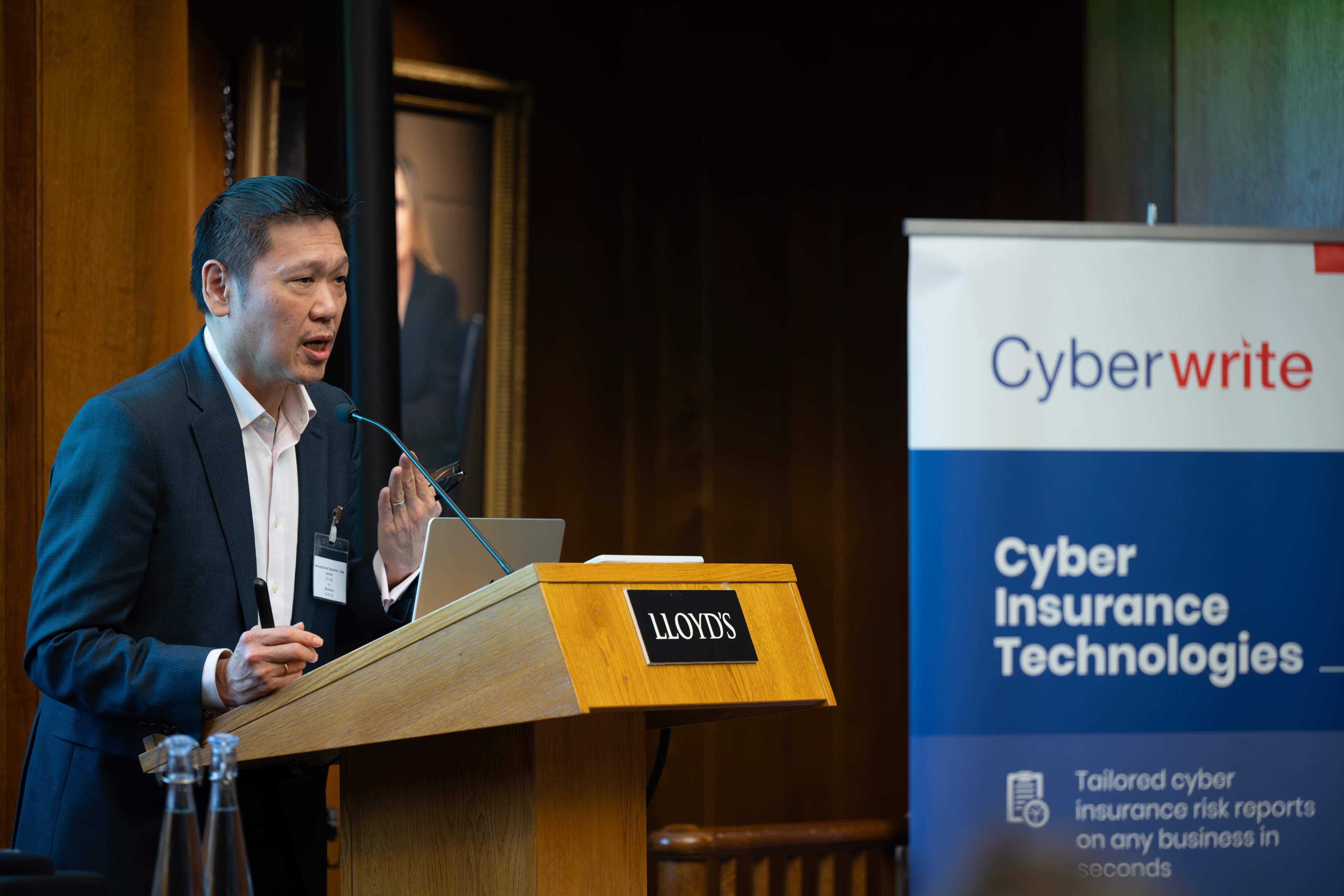 Opening the briefing at the Lloyd's podium.