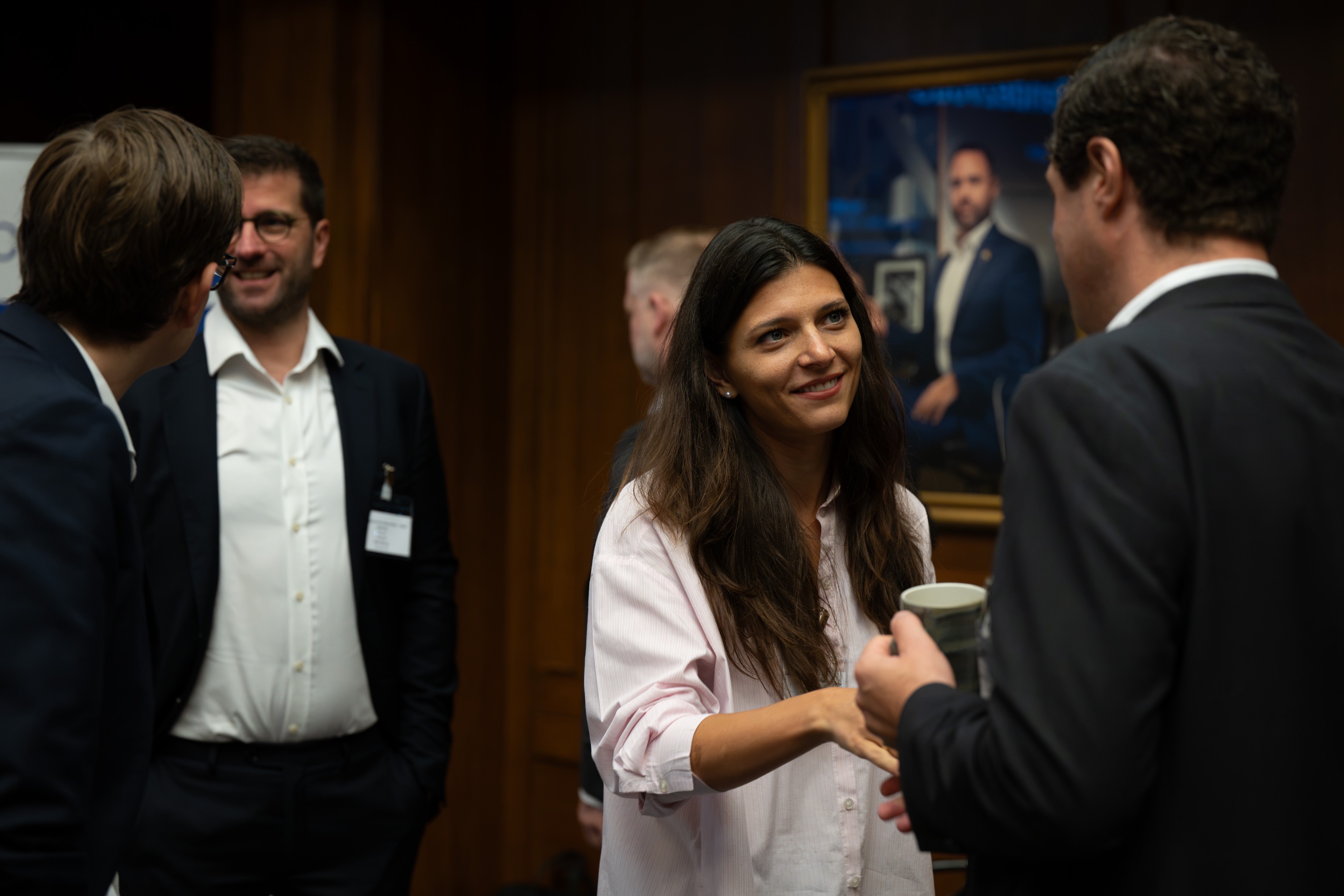 Attendees networking in the Old Library.